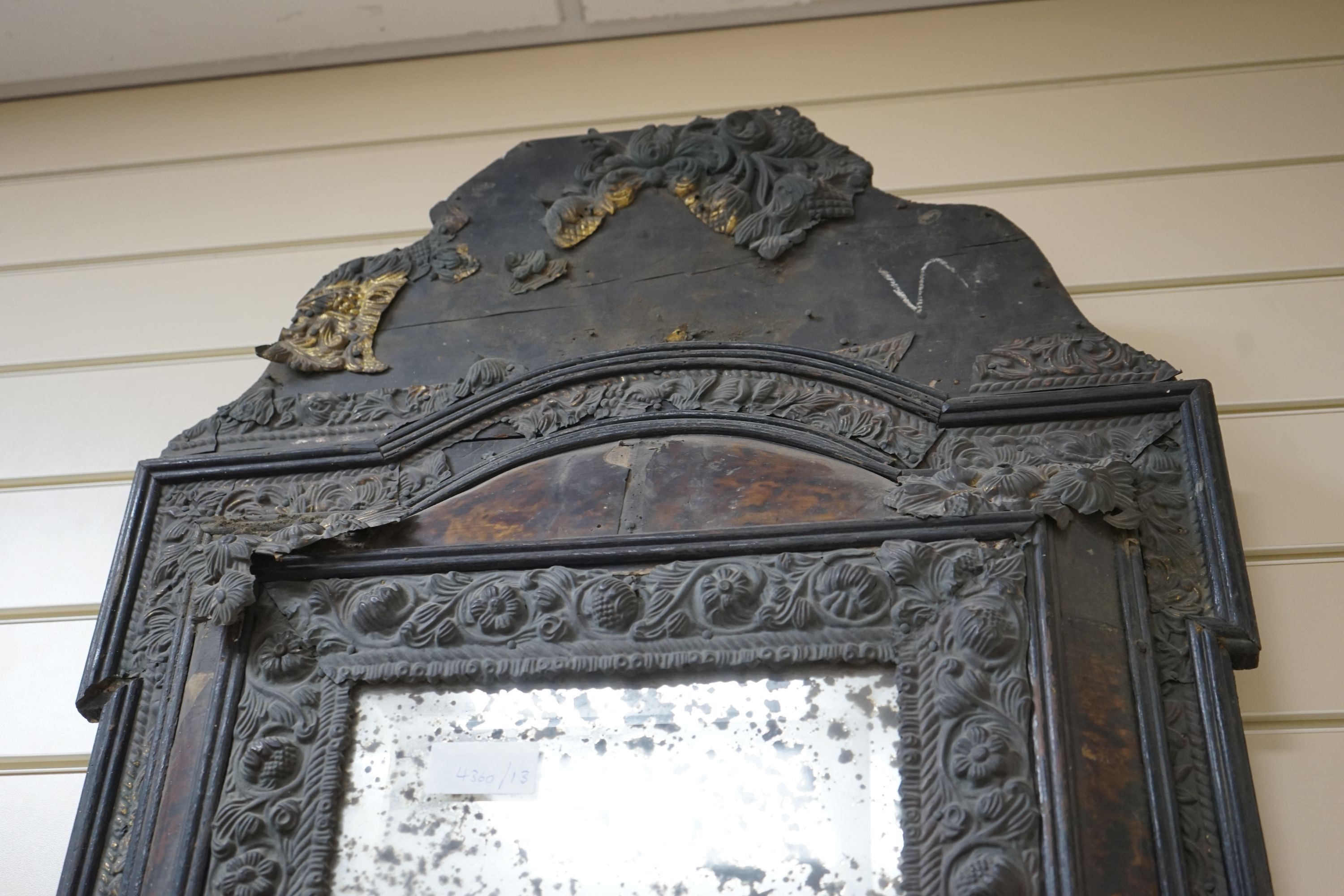 A 19th century Dutch brass and tortoiseshell wall mirror, width 58 cms, height 90 cms.